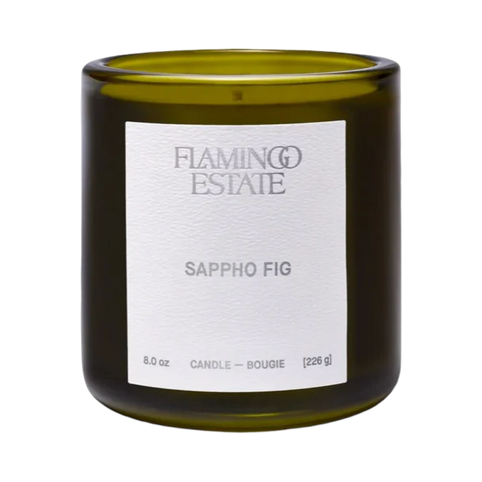 Flamingo Estate Sappho Fig Candle in a recyclable glass vessel, scented with green fig, cardamom, and sandalwood.