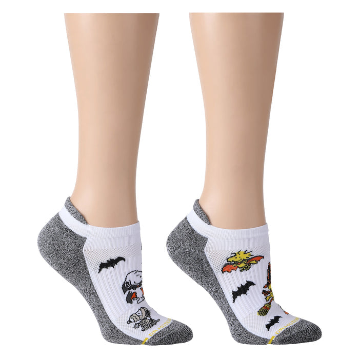 White and black marled ankle compression socks featuring Peanuts Halloween designs.