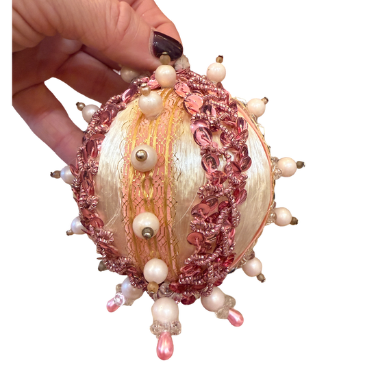 one-of-a-kind vintage ivory satin Christmas ornament with pink sequins, delicate pearl accents, gold trim, and dangling pink beads.