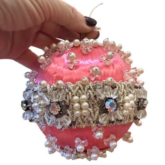 one-of-a-kind vintage pink satin Christmas ornament featuring sparkling rhinestones, faux pearls, silver trim, and intricate handmade details.