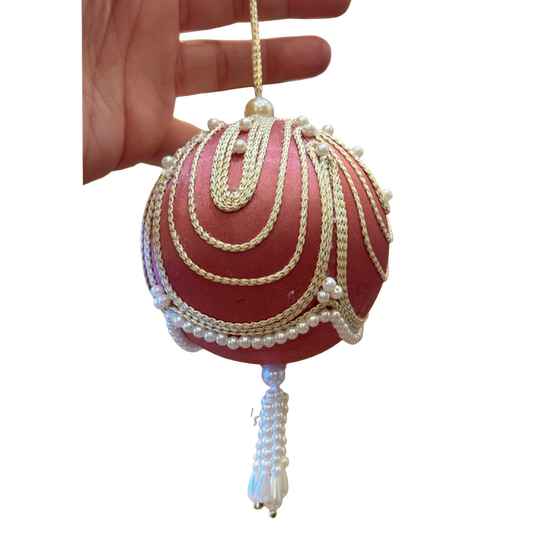 beautiful vintage pink satin Christmas ornament with cascading gold trim, faux pearl embellishments, and a decorative beaded tasse